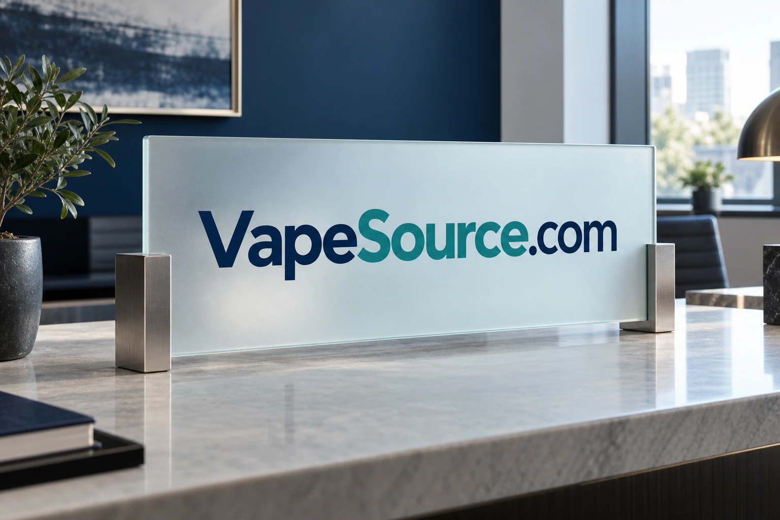 VapeSource.com lettering on frosted glass in an editorial workspace